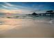 Scenic beach at sunset with pier in background at 898 Skye Ln, Palm Harbor, FL 34683