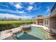 Inviting pool and spa with a picturesque view of the golf course at 898 Skye Ln, Palm Harbor, FL 34683
