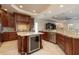 Gourmet kitchen with granite countertops, stainless steel appliances, and custom cabinetry at 898 Skye Ln, Palm Harbor, FL 34683