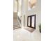 Elegant entryway featuring double doors and a grand staircase at 898 Skye Ln, Palm Harbor, FL 34683