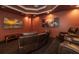 Elegant home theater with comfortable reclining seats and a large screen at 898 Skye Ln, Palm Harbor, FL 34683