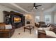 Gathering room with a fireplace, built-in shelving, and leather sofas at 898 Skye Ln, Palm Harbor, FL 34683
