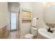 Powder room with single vanity and a view of the backyard at 898 Skye Ln, Palm Harbor, FL 34683