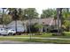 One-story house with two-car garage, mature landscaping, and a spacious driveway at 24449 Painter Dr, Land O Lakes, FL 34639