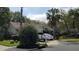 One-story house with two-car garage, mature landscaping, and a spacious driveway at 24449 Painter Dr, Land O Lakes, FL 34639
