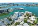 Aerial view of waterfront property with boat slips and nearby buildings at 211 Dolphin Pt # 303, Clearwater, FL 33767