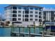 Modern building exterior with waterfront access and boat slips at 211 Dolphin Pt # 303, Clearwater, FL 33767