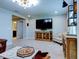 Open living area with a large TV and stylish furniture at 12874 Burns Dr, Odessa, FL 33556