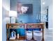 Rustic wooden console table adds warmth to the entryway at 12874 Burns Dr, Odessa, FL 33556