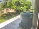 The property features a fenced backyard, air conditioning unit, and lush trees at 2256 Philippine Dr # 46, Clearwater, FL 33763