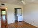 Bedroom features closet with stacked laundry unit and wood-look flooring at 2256 Philippine Dr # 46, Clearwater, FL 33763