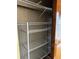 Interior of closet with adjustable wire shelving and wooden door at 2256 Philippine Dr # 46, Clearwater, FL 33763