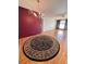 Dining area featuring hardwood floors and a large circular rug at 2256 Philippine Dr # 46, Clearwater, FL 33763