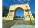 Community entrance featuring an archway with statues and well-maintained landscaping at 2256 Philippine Dr # 46, Clearwater, FL 33763