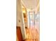 Hallway featuring updated flooring and view into bathroom and other rooms at 2256 Philippine Dr # 46, Clearwater, FL 33763