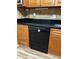 Modern black dishwasher in updated kitchen at 2256 Philippine Dr # 46, Clearwater, FL 33763