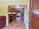 Cozy kitchen featuring wood cabinets, black countertops, and modern appliances at 2256 Philippine Dr # 46, Clearwater, FL 33763