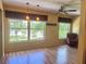 Inviting living room featuring large windows, ceiling fan, and comfortable seating at 2256 Philippine Dr # 46, Clearwater, FL 33763