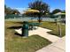 Picnic tables with umbrella near tennis courts at 2256 Philippine Dr # 46, Clearwater, FL 33763