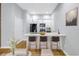 Modern kitchen with white cabinetry, stainless appliances, and an island with bar seating for entertaining at 535 4Th S Ave # 1, St Petersburg, FL 33701