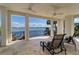 Spacious, covered balcony with lounge chairs provides sweeping views of the water at 6627 Bayou Grande Ne Blvd, St Petersburg, FL 33702