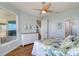 Comfortable bedroom offers hardwood floors, bright walls, and access to ensuite bathroom at 6627 Bayou Grande Ne Blvd, St Petersburg, FL 33702