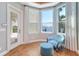Cozy bedroom sitting area with water views and a comfortable chair and ottoman at 6627 Bayou Grande Ne Blvd, St Petersburg, FL 33702