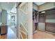 Spacious walk-in closet with custom shelving and storage solutions next to a main bedroom at 6627 Bayou Grande Ne Blvd, St Petersburg, FL 33702