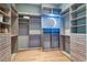 Spacious walk-in closet with custom shelving, drawers, and ample storage space for an organized wardrobe at 6627 Bayou Grande Ne Blvd, St Petersburg, FL 33702