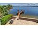 Patio with waterfront views and private dock access, perfect for outdoor dining and relaxation at 6627 Bayou Grande Ne Blvd, St Petersburg, FL 33702