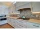 Bright kitchen featuring a gas cooktop, modern appliances, custom cabinetry, and under cabinet lighting at 6627 Bayou Grande Ne Blvd, St Petersburg, FL 33702