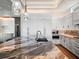 Kitchen island with a marble countertop and lots of cabinets, accompanied by stainless steel appliances and hardwood floors at 6627 Bayou Grande Ne Blvd, St Petersburg, FL 33702