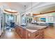 Open concept kitchen featuring a large kitchen island, breakfast nook, and living room at 6627 Bayou Grande Ne Blvd, St Petersburg, FL 33702