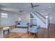 Bright living room with hardwood floors, recessed lighting, and staircase leading to second floor at 6627 Bayou Grande Ne Blvd, St Petersburg, FL 33702