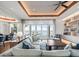 Spacious living room with modern lighting, built-in shelving, and water views at 6627 Bayou Grande Ne Blvd, St Petersburg, FL 33702