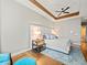 Well-lit main bedroom with a modern bed, stylish rug, and elegant tray ceiling at 6627 Bayou Grande Ne Blvd, St Petersburg, FL 33702