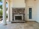 Outdoor patio with a stone fireplace, creating a cozy and inviting atmosphere for entertaining at 6627 Bayou Grande Ne Blvd, St Petersburg, FL 33702