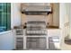 Outdoor kitchen area featuring stainless steel grill, storage, and countertop space at 6627 Bayou Grande Ne Blvd, St Petersburg, FL 33702