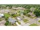 Home exterior surrounded by lush landscaping in a quiet residential area, with neighborhood views at 2305 N Tampania Ave, Tampa, FL 33607