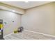 Finished basement area with new flooring and ample space for storage and utilities at 2305 N Tampania Ave, Tampa, FL 33607