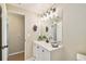 Well-lit bathroom featuring a modern vanity with a quartz countertop and stylish fixtures and tile at 2305 N Tampania Ave, Tampa, FL 33607