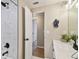 Bright bathroom features marble-tiled shower, modern fixtures, and neutral tones at 2305 N Tampania Ave, Tampa, FL 33607