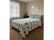 Inviting bedroom features a cozy bed with decorative pillows and nautical-themed comforter at 2305 N Tampania Ave, Tampa, FL 33607