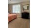 Bedroom featuring a large dresser and soft, natural light from the window at 2305 N Tampania Ave, Tampa, FL 33607