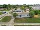 Charming single-story home featuring a well-manicured lawn and inviting blue shutters at 2305 N Tampania Ave, Tampa, FL 33607