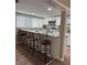 Modern kitchen with stainless steel appliances, granite countertops, and stylish bar seating for casual dining at 2305 N Tampania Ave, Tampa, FL 33607