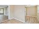 Clean and simple hallway with tile and wood flooring at 2305 N Tampania Ave, Tampa, FL 33607
