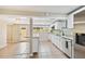 Modern kitchen with white shaker cabinets, granite countertops, and stainless steel appliances at 2305 N Tampania Ave, Tampa, FL 33607