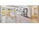 Modern kitchen with white cabinets, stainless steel appliances, and tile floors at 2305 N Tampania Ave, Tampa, FL 33607