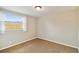 Well-lit bedroom featuring a large window and neutral wall tones at 2305 N Tampania Ave, Tampa, FL 33607